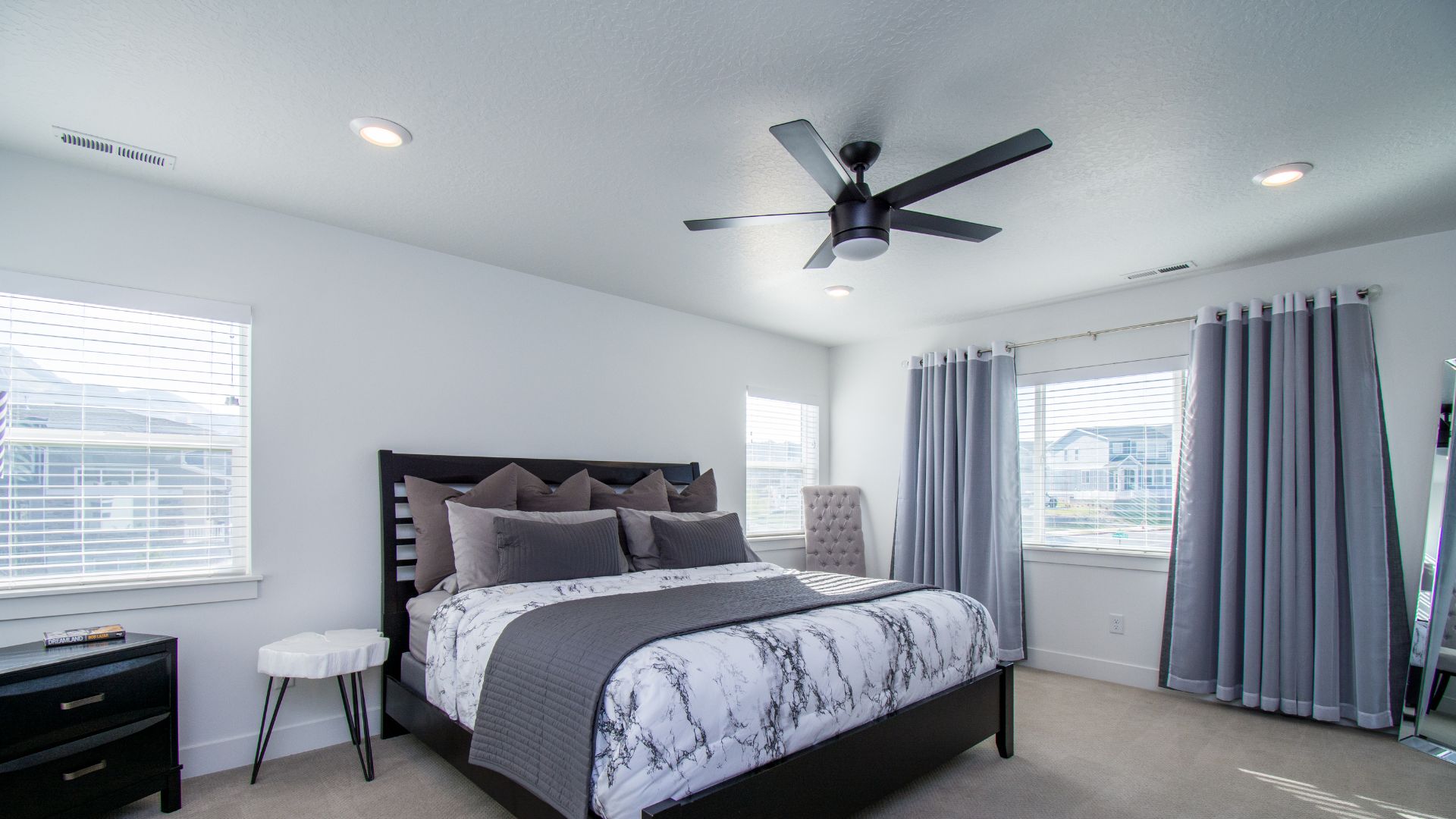 Clean bedroom with ceiling fan